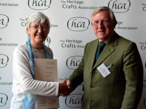 Jean Leader being presented with her award